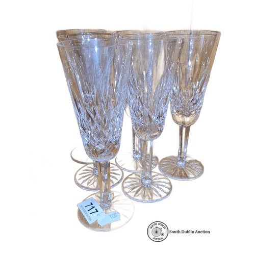 717 - Star Lot : Set of six Waterford crystal champagne flutes, elegantly cut, featuring the signature Wat... 