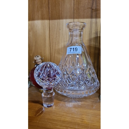 719 - A beautiful Waterford Cut glass decanter with faceted stopper and intricate diamond pattern design. ... 