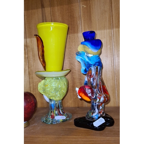 720 - Two large Murano glass clown sculptures feature vibrant multicolored designs. They are hand-blown wi... 