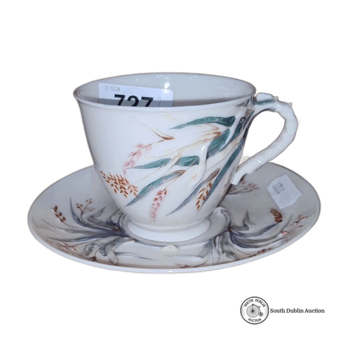 727 - Belleek porcelain black stamp teacup and saucer, featuring hand-painted botanical motifs. Made in Ir... 