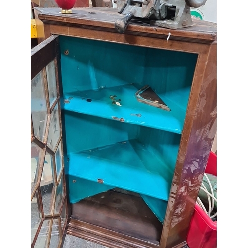 734 - Antique Mahogany corner wall cabinet with glazed geometric door, from mid-century, has a blue-painte... 