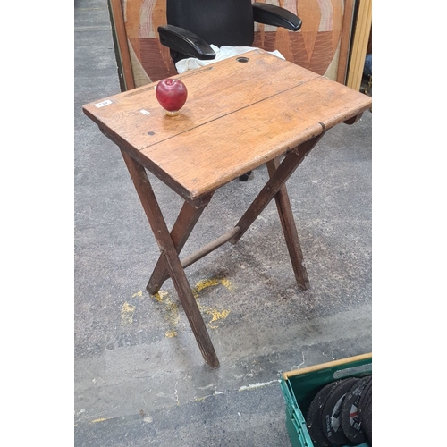 739 - Folding wooden desk, oak with ink well. Classic design.