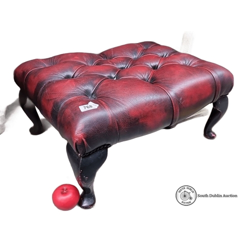 768 - Victorian-style tufted Chesterfield  footstool has mahogany legs and is upholstered in rich red leat... 