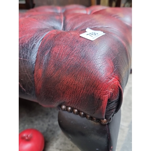 768 - Victorian-style tufted Chesterfield  footstool has mahogany legs and is upholstered in rich red leat... 