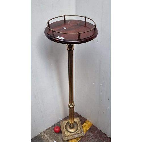 769 - Victorian style mahogany and brass pedestal stand with a fluted column and a circular top with a gal... 