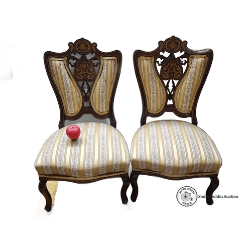 773 - Star Lot : Pair of Victorian matching side chairs with carved wood frames and elegant damask upholst... 