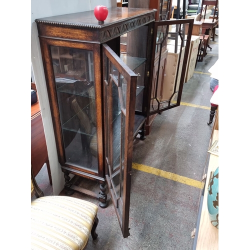 777 - Star Lot : Edwardian mahogany display cabinet with carved details, glazed doors, and turned legs. In... 