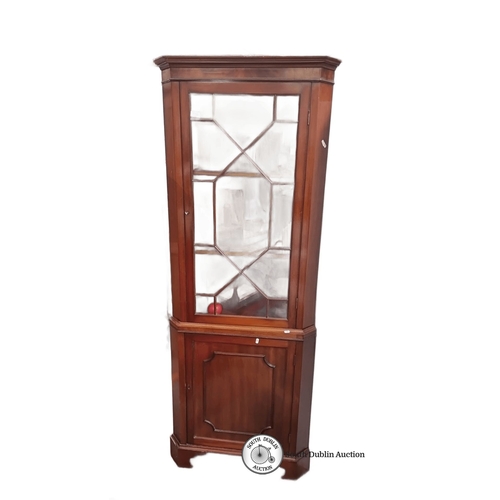 778 - Mahogany corner display cabinet with glazed door, two shelves, and panelled lower door. It's in the ... 