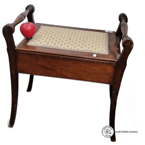 781 - Mahogany storage bench with turned handles and hinged lid, featuring a patterned fabric seat. From t... 