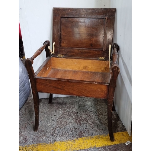 781 - Mahogany storage bench with turned handles and hinged lid, featuring a patterned fabric seat. From t... 