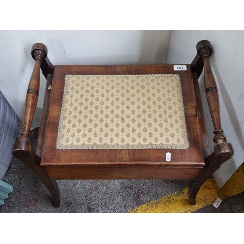 781 - Mahogany storage bench with turned handles and hinged lid, featuring a patterned fabric seat. From t... 