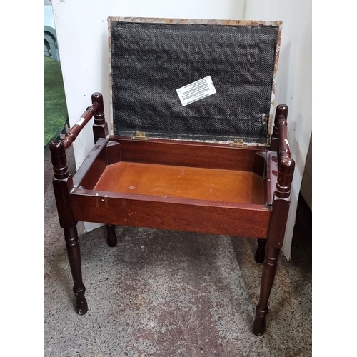 784 - Upholstered storage footstool, with turned wooden legs and floral tapestry fabric. Hinged lid reveal... 