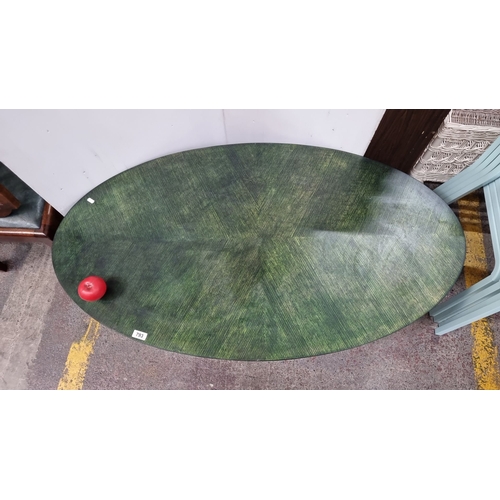 793 - A wooden oval low coffee table with green textured veneered top with green lacquered finish, modern ... 