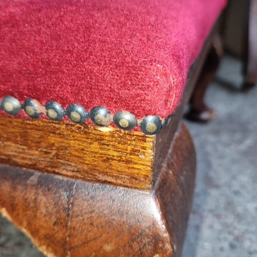 796 - Two Victorian parlor chairs with red upholstery and carved wood details. Includes matching footstool... 