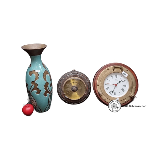 799 - Decorative trio featuring a glazed Art Nouveau style vase, an English-made brass barometer, and a Ro... 