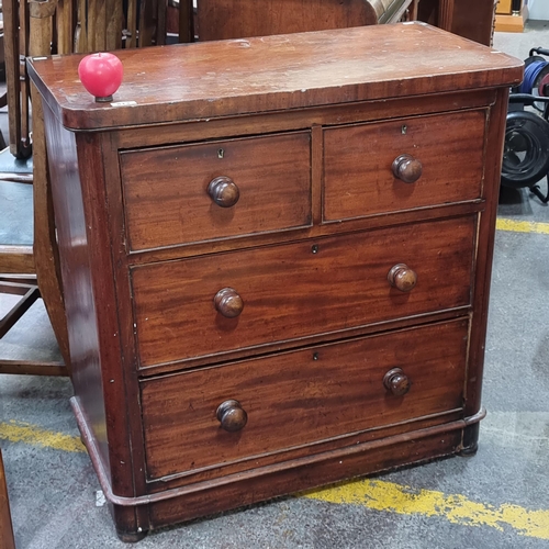 813 - A lovely antique four drawer chest of drawers with turned handles.