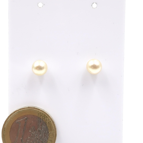 196 - A pair of sterling silver pearl stud earrings. Comes in original Mi Saki box.