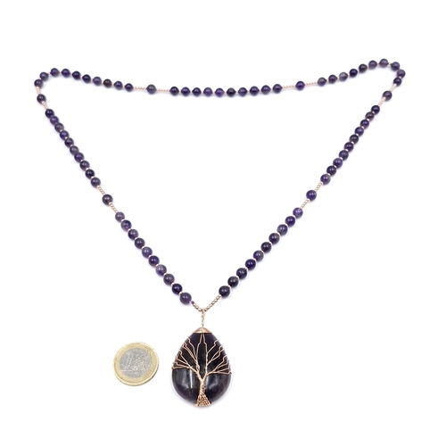 62 - An unusual Tree of Life pendant necklace with amethyst  polished beads. Length - 17 cms. Pendant - 4... 