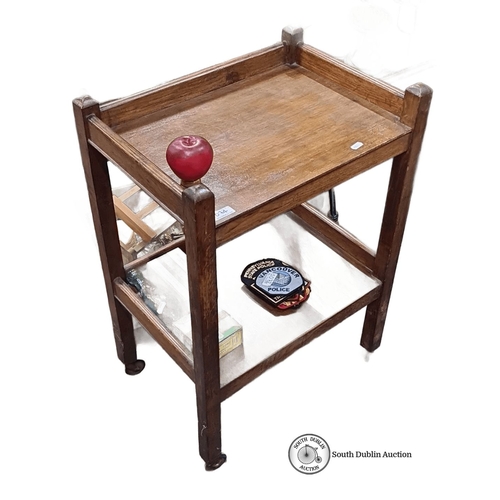 1074 - Antique wooden serving trolley, two-tiered with castor wheels, featuring natural oak finish.