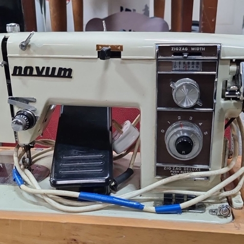 1075 - Novum Zigzag Deluxe sewing machine with hard case. Features adjustable stitch width and various sett... 