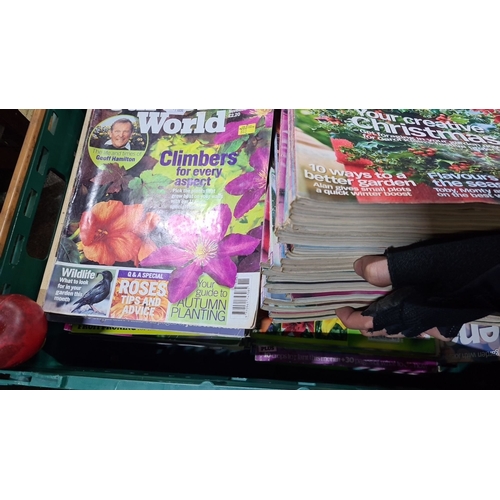 1076 - A large box of gardener world magazines.