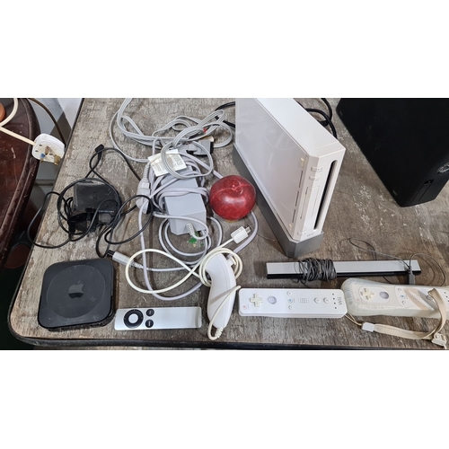 1083 - Mixed lot featuring gaming consoles: PlayStation 2, Xbox 360, Nintendo Wii with controllers; include... 