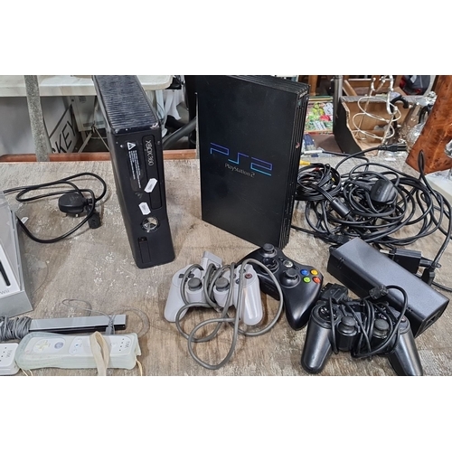 1083 - Mixed lot featuring gaming consoles: PlayStation 2, Xbox 360, Nintendo Wii with controllers; include... 