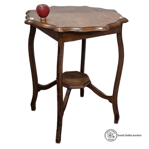 1256 - Vintage oak side table with scalloped edges and cabriole legs, featuring a hexagonal lower shelf. Fr... 