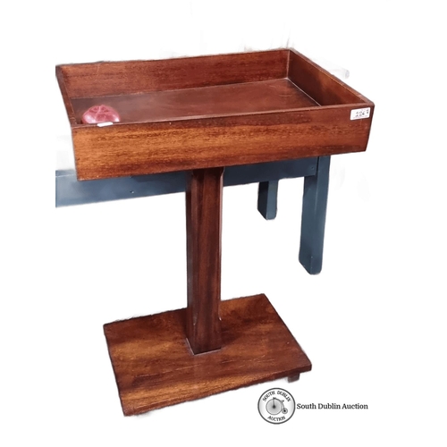 1267 - Star Lot : Mahogany side table with tray top features sturdy pedestal base and rich wood grain. Mid-... 