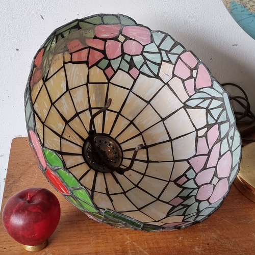 1284 - Stained glass lamp shade featuring floral motif with pink, red, and green detailing. It has a dome-s... 