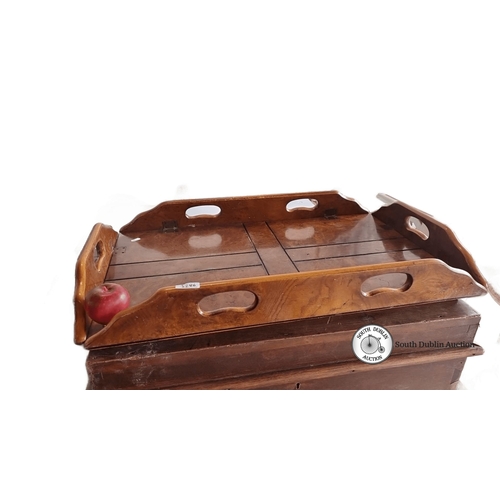 1286 - An antique wooden butler's tray with cut-out handles, showcasing burl wood veneer and hinged foldabl... 