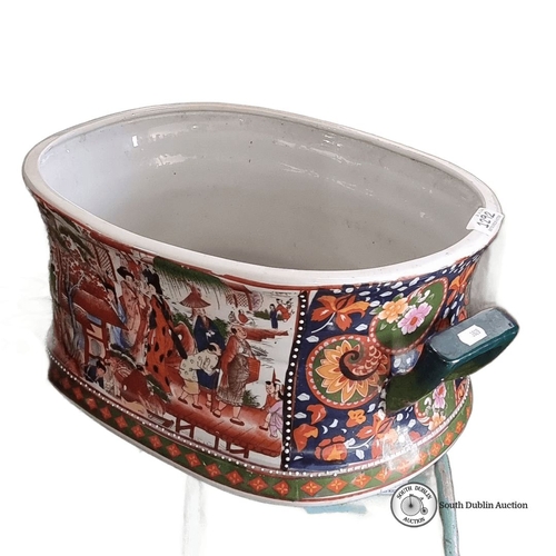 1292 - A very large Imari style porcelain oval foot bath, planter with vibrant hand-painted scenes and flor... 