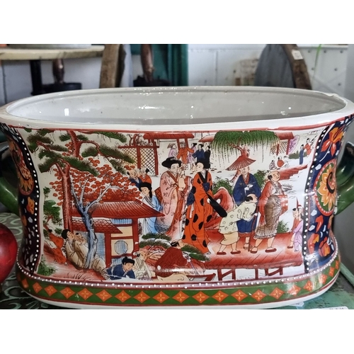 1292 - A very large Imari style porcelain oval foot bath, planter with vibrant hand-painted scenes and flor... 