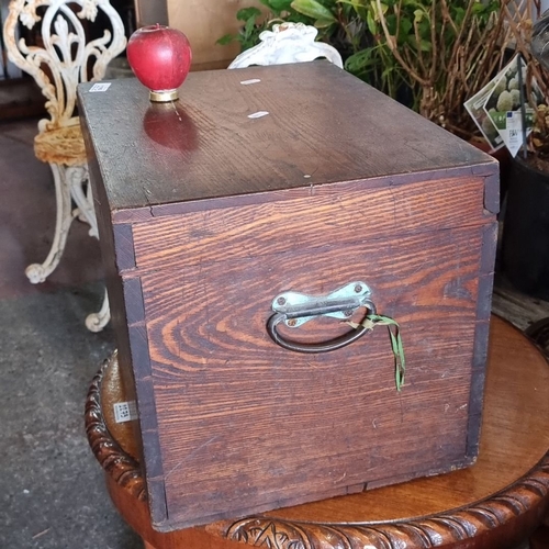 1295 - Antique wooden storage box with hinged lid, featuring rich wood grain and timeless design.