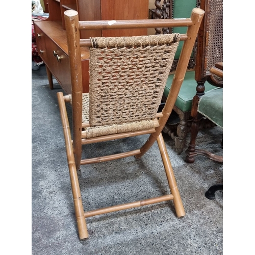 953 - Bamboo folding chair with a woven natural fiber seat, Mid-Century Modern design.