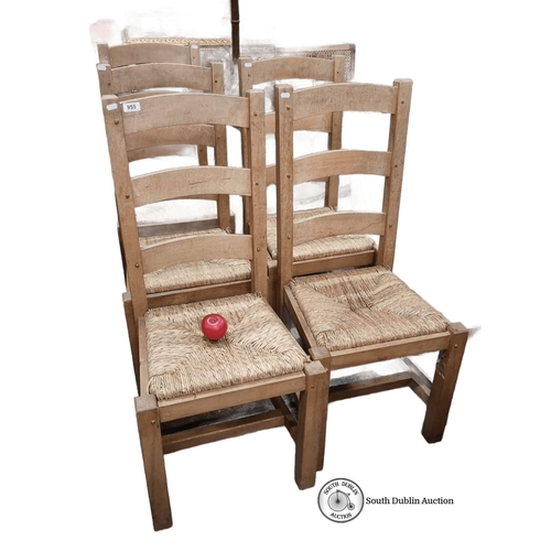 955 - Set of five rustic oak chairs with woven sugar  seats. In good order.