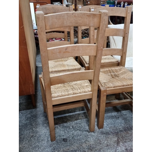 955 - Set of five rustic oak chairs with woven sugar  seats. In good order.