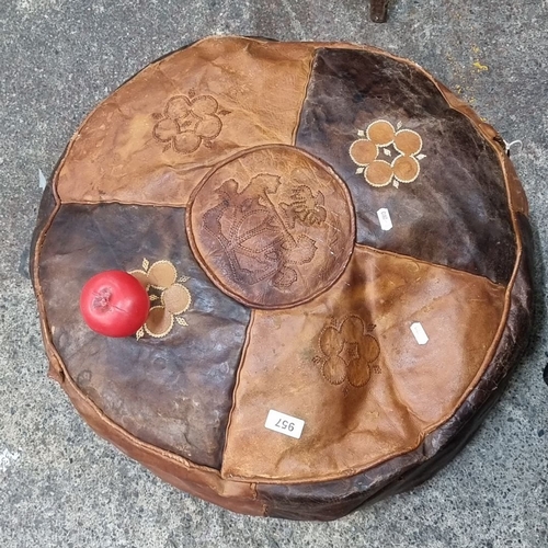 957 - Vintage leather pouf with decorative floral embroidery.