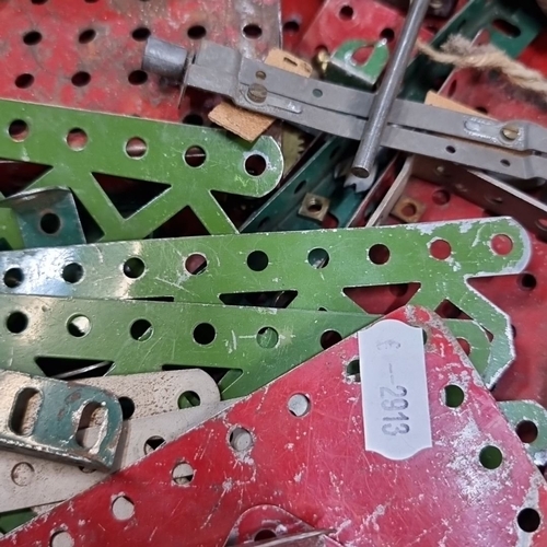 958 - Vintage Meccano set, assorted metal parts. Includes green and red perforated strips and plates, gear... 