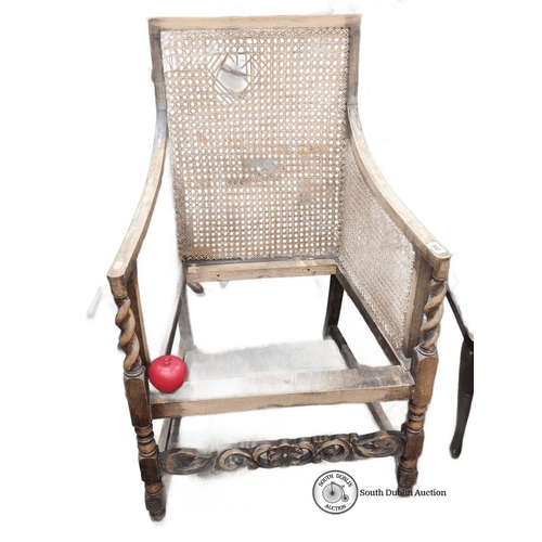 960 - Antique caned armchair with carved wood detailing, from the late 19th to early 20th century. Feature... 