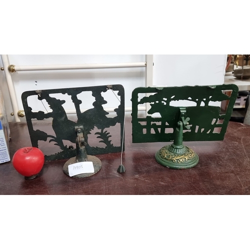 977 - Pair of cast iron book holders  with colorful rooster and cow motifs, from the mid-20th century. The... 