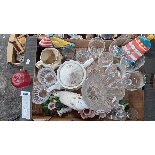 998 - Mixed lot includes crystal glassware, ceramic teapot with floral design, porcelain dog figurine, and... 