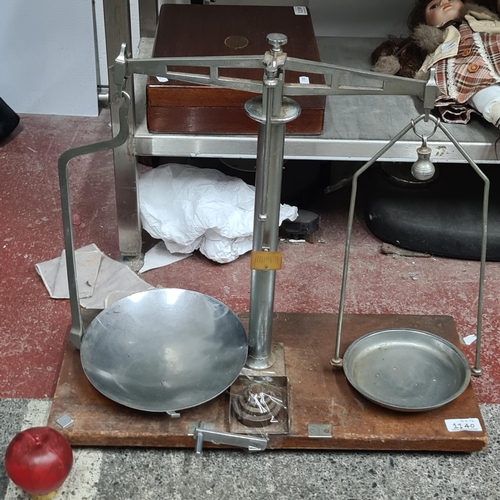 1140 - A fantastic Mid Century shops balance weighing scales complete with its original brass weights.