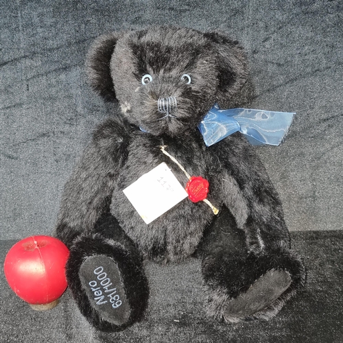 1179 - A large Hermann Teddy Original Black Bear with blue ribbon. With Serial number on paw and tags.