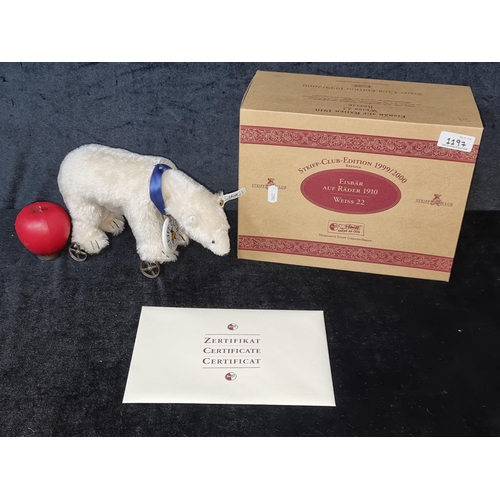 1197 - Star Lot : An original 1999 edition polar bear on wheels Steiff Teddy Bear (No.100) adorning a blue ... 