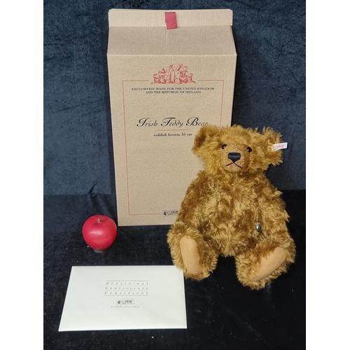 1207 - A Steiff Irish Teddy Bear in reddish brown 35cm. No. 380 out of 2,000. Comes with a Celtic locket pe... 