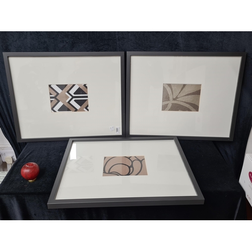 1221 - A series of three prints. Features abstract shapes and forms. Housed in matching smart black frames ... 