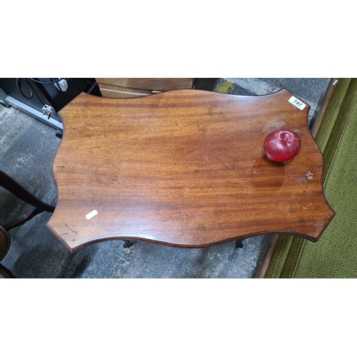 1316 - Antique mahogany table featuring cabriole legs and scalloped edges. From the Edwardian era.
Previous... 