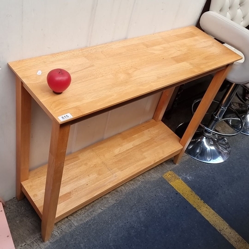 1326 - Two-tier console table in light oak, showcasing a simple yet elegant design.
Previous in auction on ... 