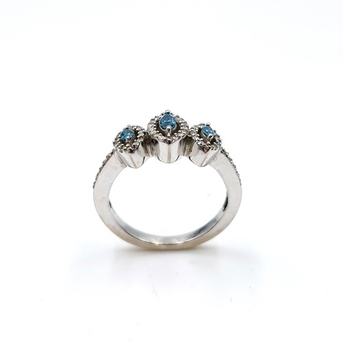 1354 - An outstanding 18 carat white gold marquis shaped blue and white brilliant cut diamond triple cluste... 